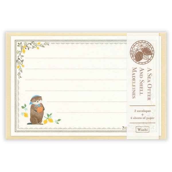 Packaging of A Sea Otter and Shell Madeleines stationery set with a design of an otter holding a shell.
