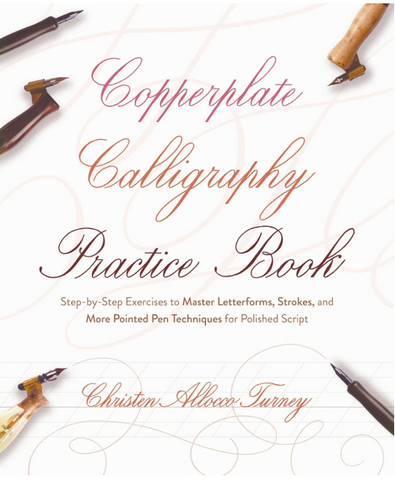 Copperplate Calligraphy Practice Book with calligraphy tools on a white background